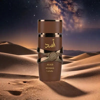 Lattafa Asad Bourbon Eau De Parfum Spray bottle in desert background, showcasing its unisex fragrance and elegant design.