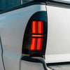 AlphaRex 05-15 Toyota Tacoma NOVA-Series Prismatic LED Tail Lights Alpha-Black OffRoadUSA.com