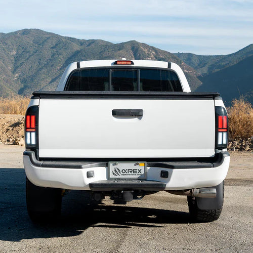 AlphaRex 05-15 Toyota Tacoma NOVA-Series Prismatic LED Tail Lights Alpha-Black OffRoadUSA.com