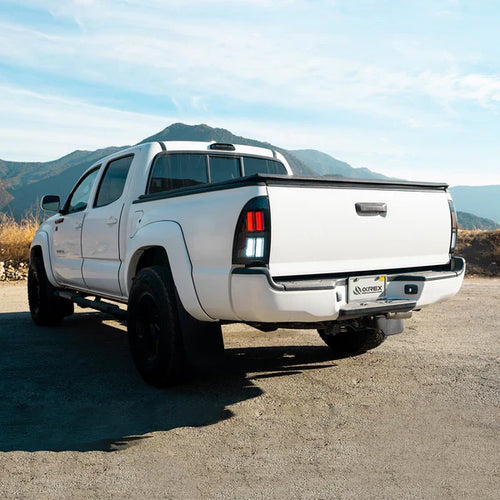 AlphaRex 05-15 Toyota Tacoma NOVA-Series Prismatic LED Tail Lights Alpha-Black OffRoadUSA.com