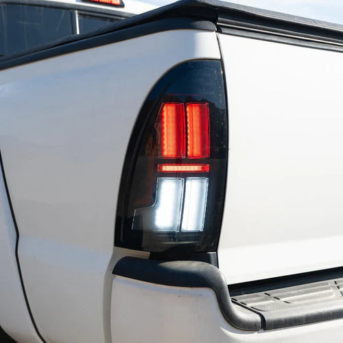 AlphaRex 05-15 Toyota Tacoma NOVA-Series Prismatic LED Tail Lights Alpha-Black OffRoadUSA.com