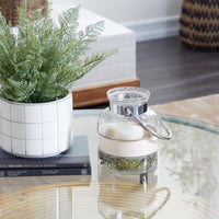 The Novogratz Clear Glass Decorative Candle Lantern with Curved Handle EasyOptionXY LLC