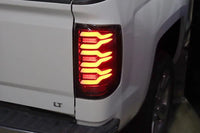AlphaRex 14-18 Chevrolet Silverado 1500 / 15-19 Silverado 2500HD/3500HD / 15-19 GMC Sierra 3500HD Dually LUXX-Series LED Tail Lights Black OffRoadUSA.com