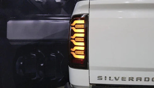 AlphaRex 14-18 Chevrolet Silverado 1500 / 15-19 Silverado 2500HD/3500HD / 15-19 GMC Sierra 3500HD Dually LUXX-Series LED Tail Lights Black OffRoadUSA.com