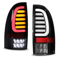 Winjet 2005-2015 Toyota Tacoma LED Sequential Tail Light w/Yellow Turn Signal - Glossy Black / Clear OffRoadUSA.com