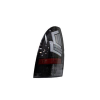 Winjet Toyota Tacoma 2005-15 Sequential Tail Lights - Black/Clear OffRoadUSA.com