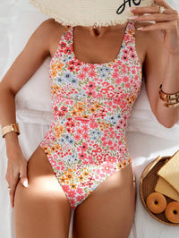 Sweet summer style in a floral print one-piece swimsuit. Embrace the sunshine and enjoy your vacation in this charming swimwear