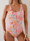Sweet summer style in a floral print one-piece swimsuit. Embrace the sunshine and enjoy your vacation in this charming swimwear