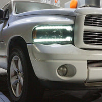 AlphaRex 02-05 Dodge Ram PRO-Series Halogen Projector Headlights Alpha-Black OffRoadUSA.com