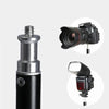 Close-up of adjustable tripod screw head compatible with camera and flash equipment for photography.