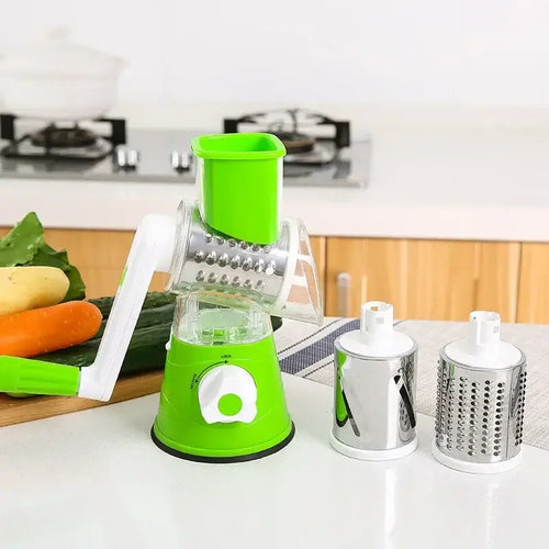 Manual rotary vegetable slicer with stainless steel drums for efficient grating and chopping in the kitchen.