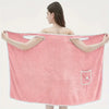 Woman wearing a coral velvet bath towel with bowknot design, showcasing water absorption and quick drying features.