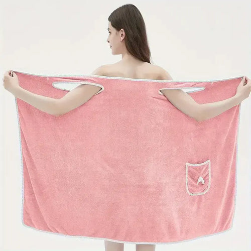 Woman wearing a coral velvet bath towel with bowknot design, showcasing water absorption and quick drying features.