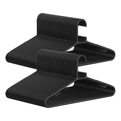 SONGMICS plastic hangers in black, designed for space-saving and lightweight clothing storage.