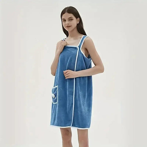 Women wearing a blue wearable bath towel with pocket, made from coral velvet for quick drying and water absorption.