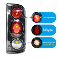 Winjet 2001-2004 Toyota Tacoma Altezza Tail Light - Black/Clear OffRoadUSA.com