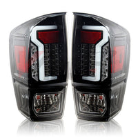 Winjet 2016-23 Toyota Tacoma LED Tail light - Glossy Black / Clear OffRoadUSA.com